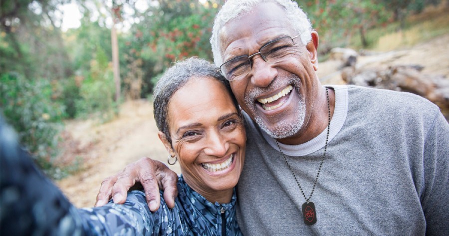 Mature African-American couple embracing and enjoying life